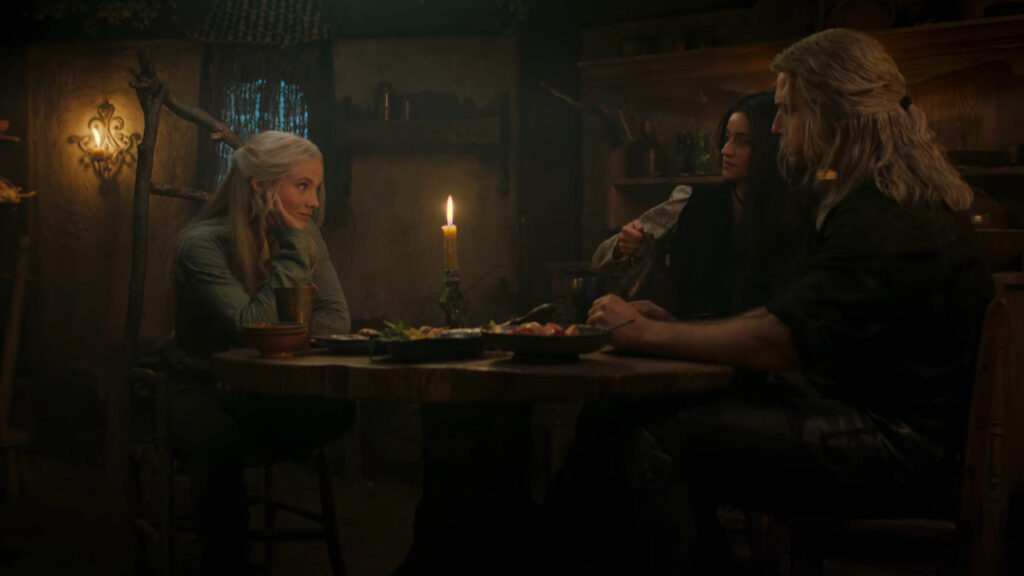 ciri, yennefer e geralt sentados à mesa na 2 temporada de the witcher